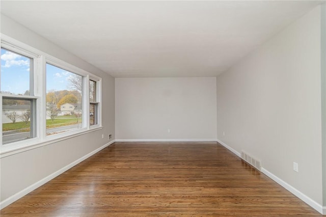 unfurnished room featuring wood-type flooring