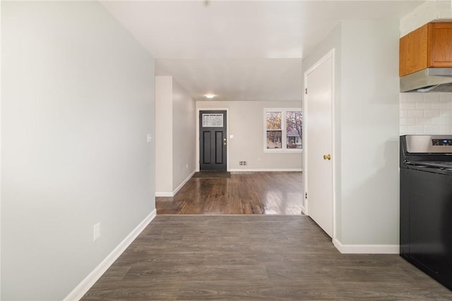 corridor with dark hardwood / wood-style floors