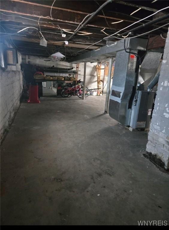 basement featuring heating unit