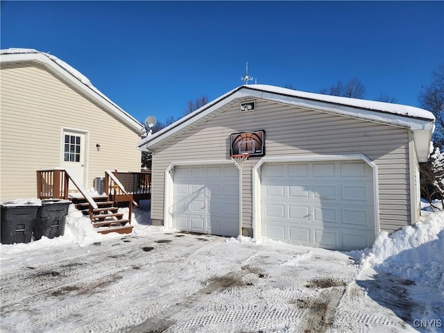 view of snow covered garage