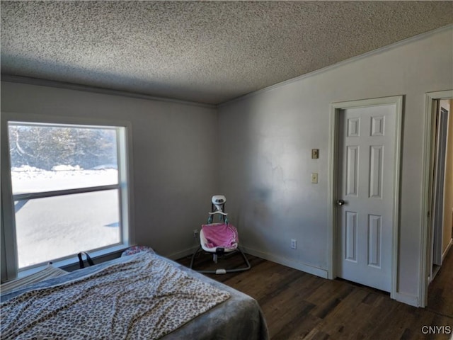 bedroom featuring crown molding, lofted ceiling, dark hardwood / wood-style floors, and a textured ceiling