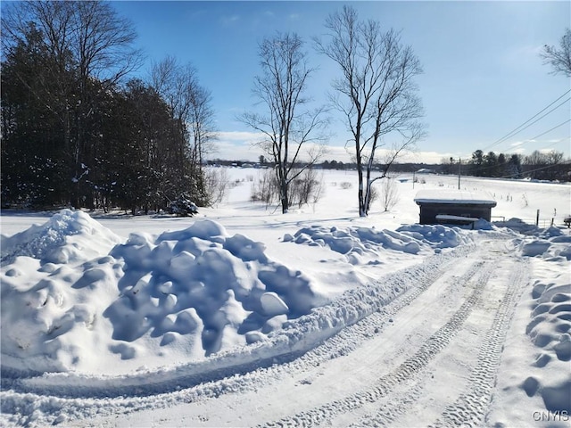 view of yard layered in snow