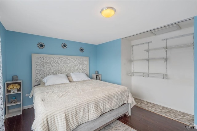 bedroom featuring dark hardwood / wood-style floors