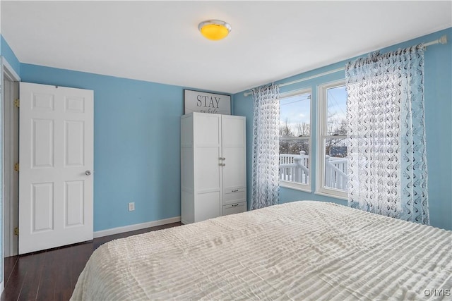 bedroom featuring dark hardwood / wood-style flooring