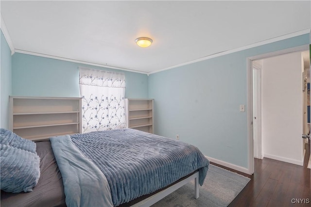 bedroom featuring crown molding and dark hardwood / wood-style flooring