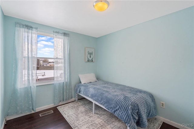 bedroom with wood-type flooring