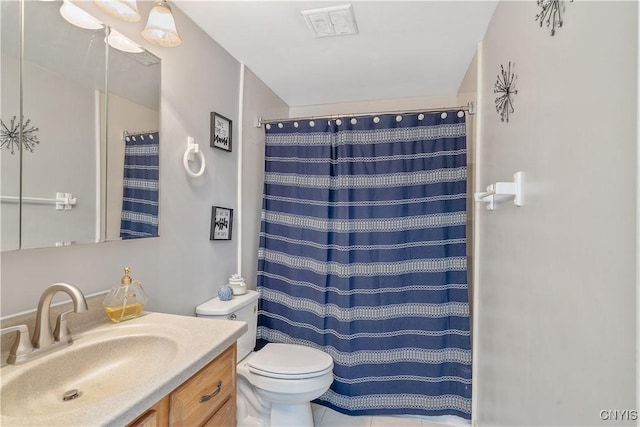 bathroom featuring vanity, toilet, and a shower with shower curtain