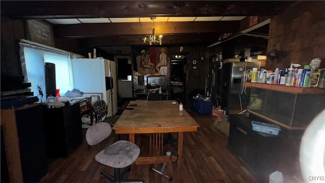 dining room featuring hardwood / wood-style flooring and a notable chandelier