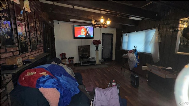 living room featuring plenty of natural light, hardwood / wood-style floors, and beam ceiling