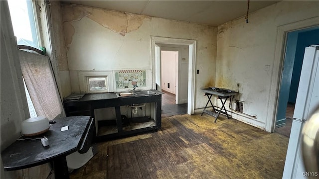 miscellaneous room featuring dark wood-type flooring