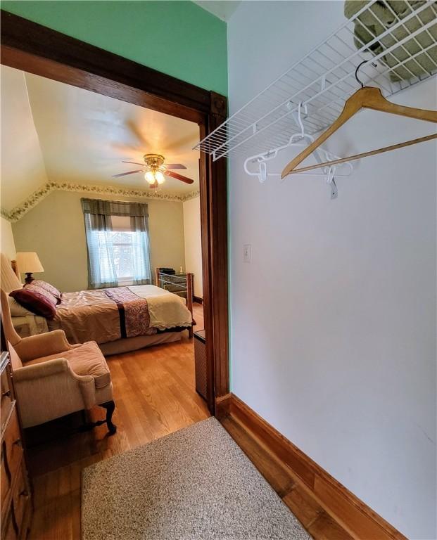 bedroom with hardwood / wood-style flooring and ceiling fan