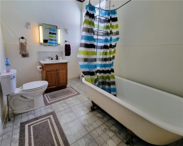 full bathroom with vanity, shower / bathtub combination with curtain, and toilet