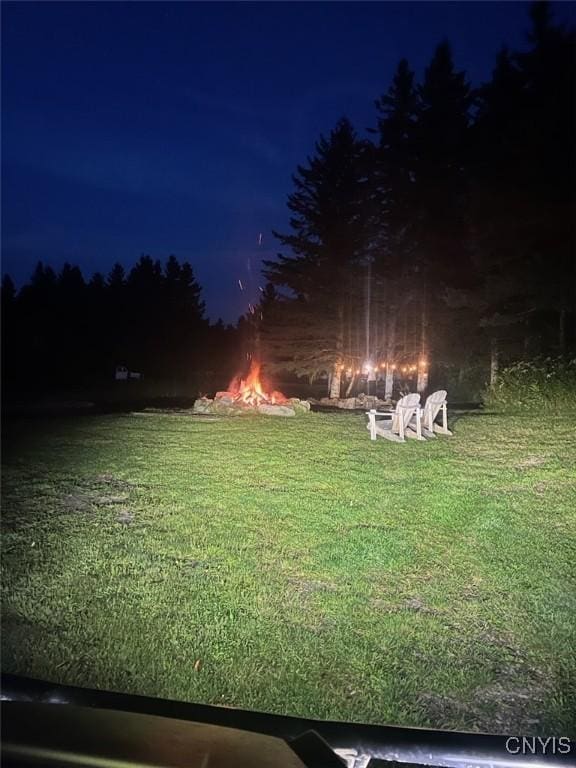 view of yard at twilight