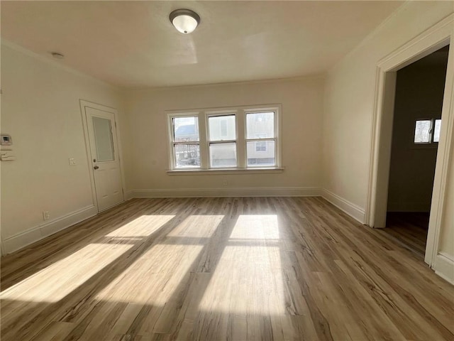 spare room with light wood-type flooring