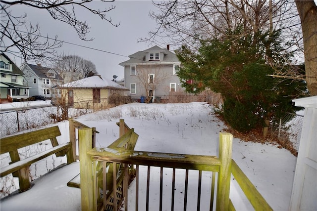 view of yard layered in snow