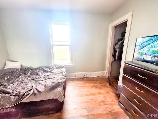 bedroom with light wood-type flooring