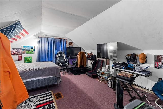 carpeted bedroom with vaulted ceiling