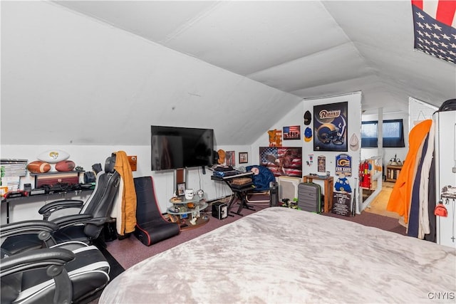 bedroom with vaulted ceiling and carpet flooring