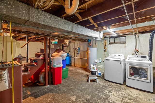 basement featuring gas water heater and independent washer and dryer