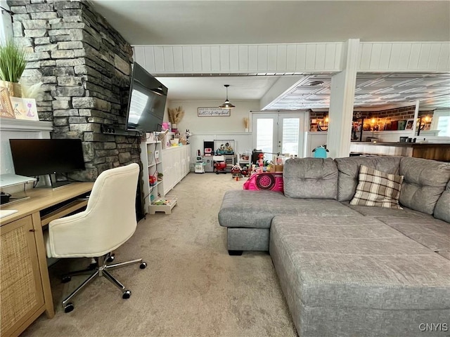 interior space with french doors, light colored carpet, and built in desk