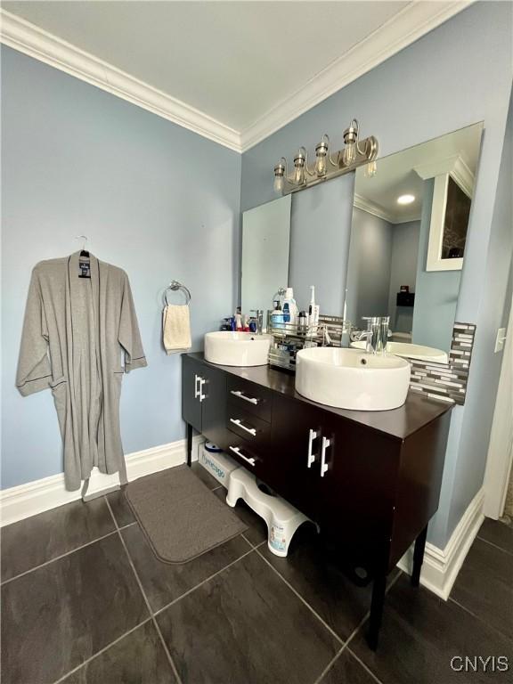 bathroom featuring vanity and crown molding