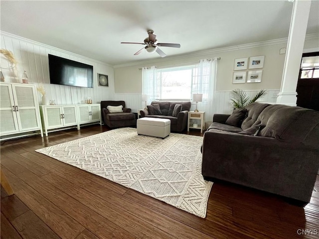 living room featuring crown molding, decorative columns, dark hardwood / wood-style floors, and ceiling fan