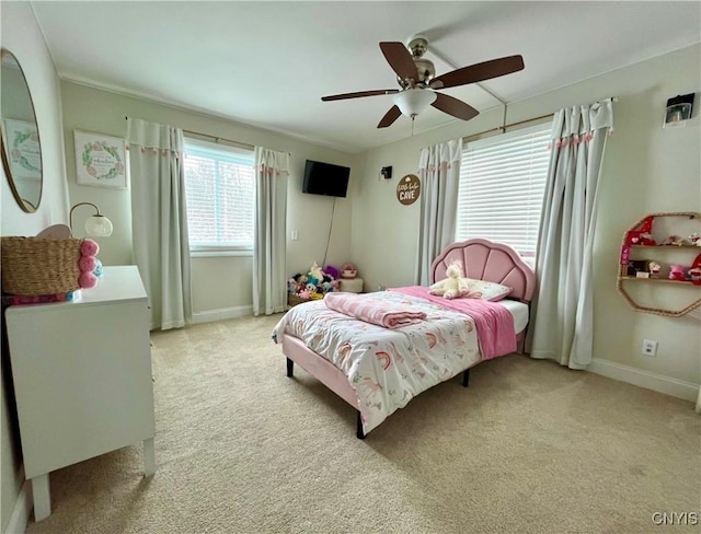 bedroom with ceiling fan and light carpet