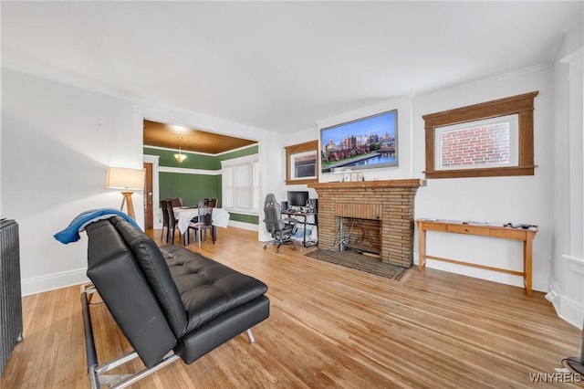 living room with wood-type flooring and a fireplace