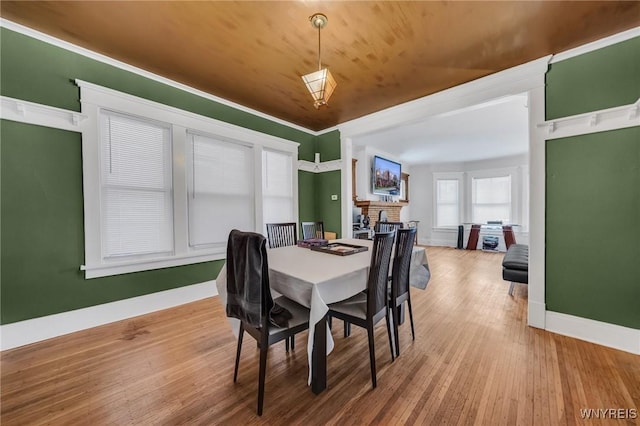 dining space with hardwood / wood-style floors