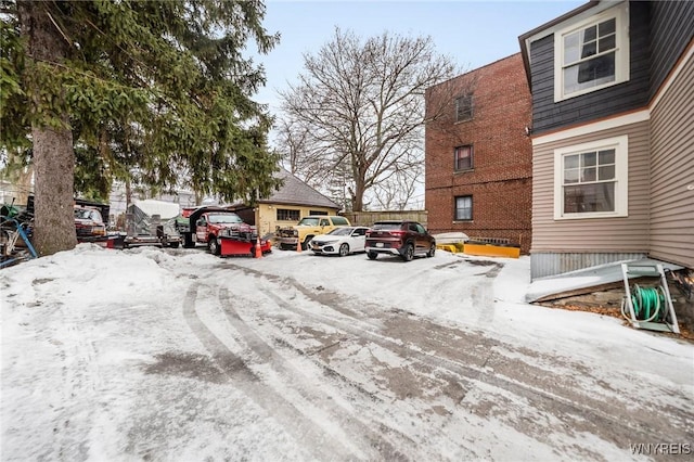 view of snow covered parking