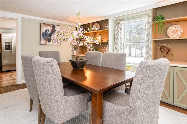 dining room with light hardwood / wood-style flooring