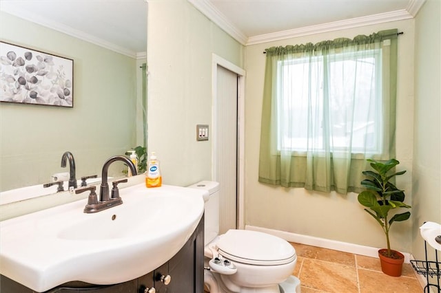 bathroom featuring ornamental molding, toilet, and sink