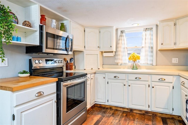 kitchen with wood counters, stainless steel appliances, dark hardwood / wood-style floors, and white cabinets