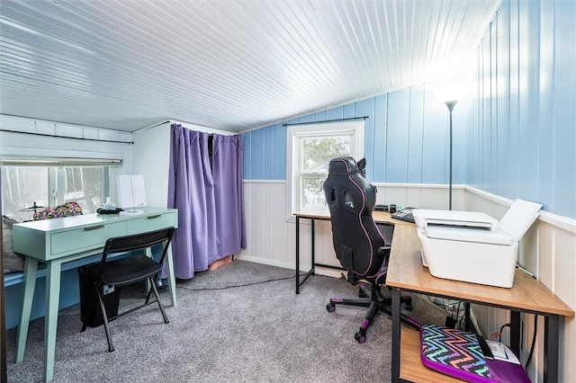 carpeted office featuring lofted ceiling