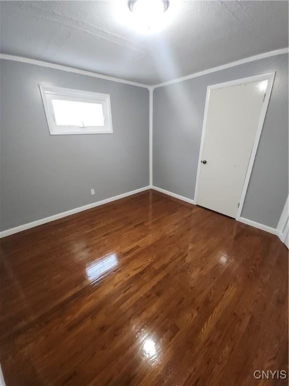 spare room featuring dark hardwood / wood-style floors