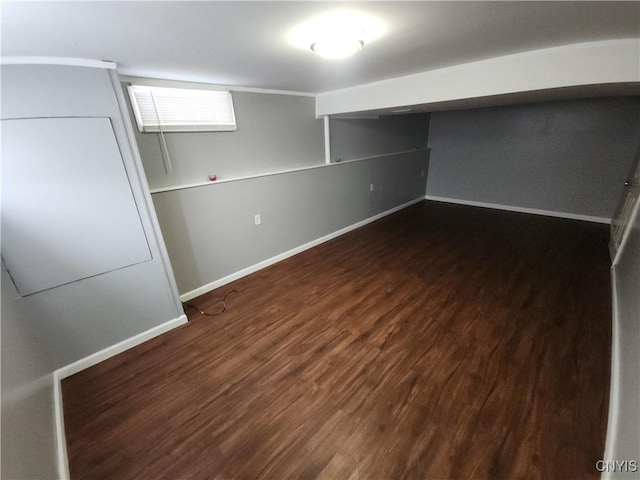 basement featuring dark wood-type flooring