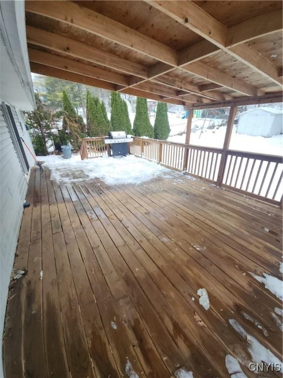 snow covered deck featuring grilling area