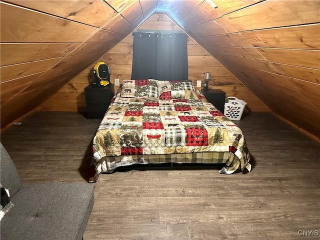 unfurnished bedroom featuring hardwood / wood-style flooring, lofted ceiling, wooden ceiling, and wooden walls