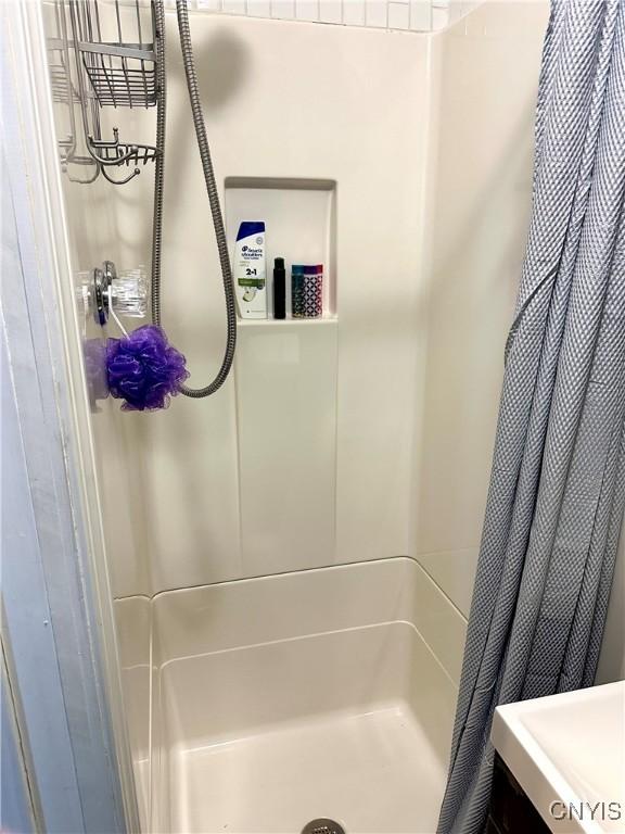 bathroom featuring walk in shower