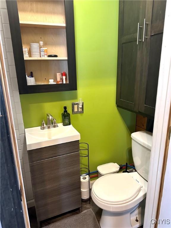 bathroom with vanity and toilet