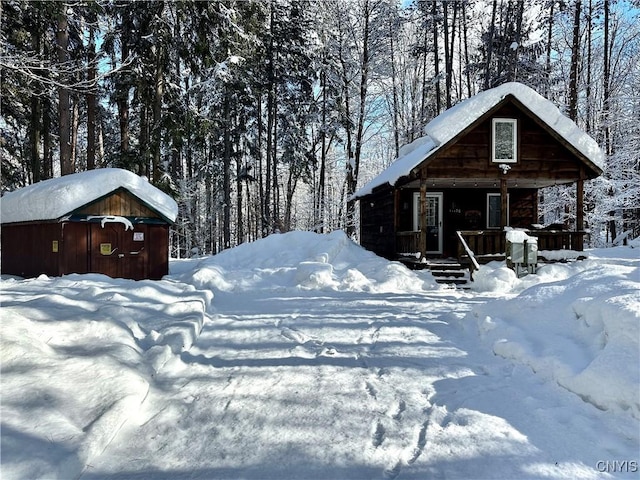 yard covered in snow with a porch