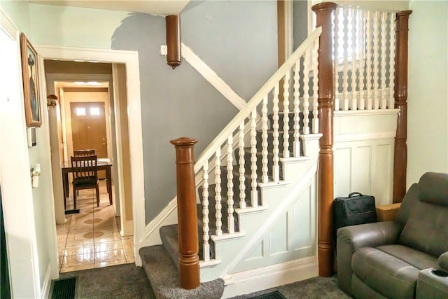 staircase featuring tile patterned floors