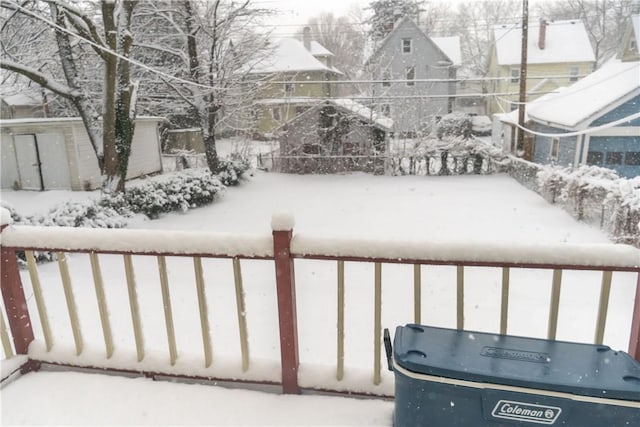 view of yard layered in snow