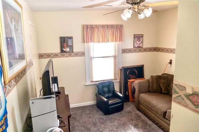 sitting room featuring carpet floors and ceiling fan