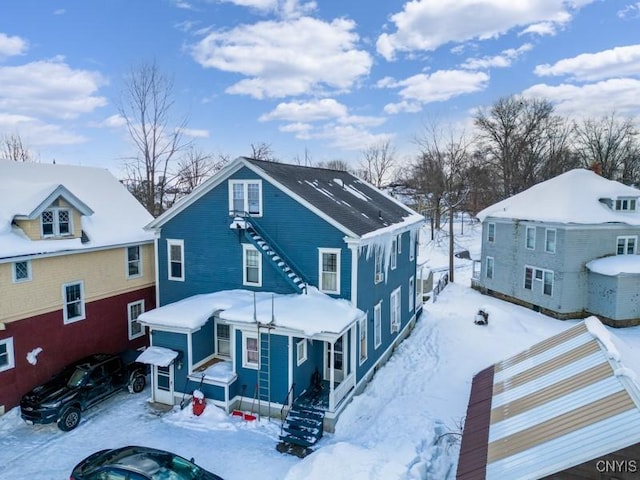 view of snow covered house