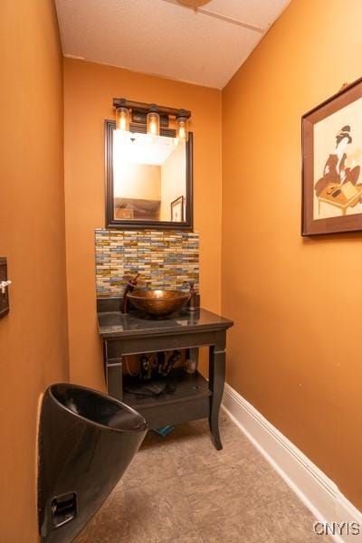 bathroom featuring tasteful backsplash