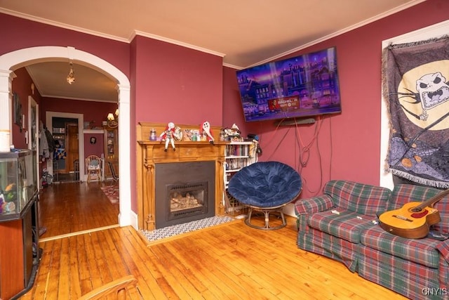 living room featuring crown molding and wood-type flooring