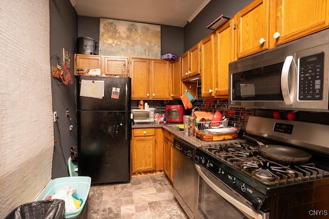 kitchen featuring appliances with stainless steel finishes, sink, and backsplash