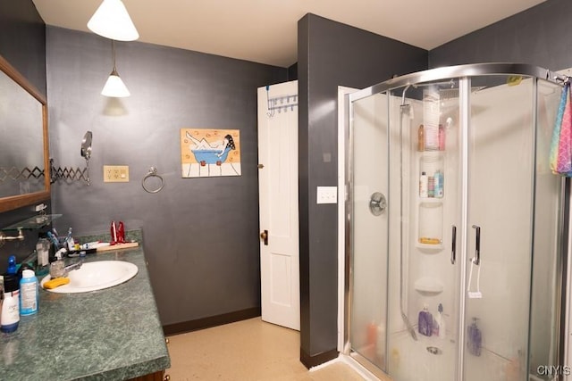 bathroom with vanity and an enclosed shower