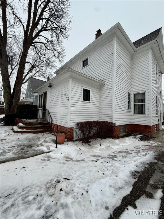 view of snow covered property